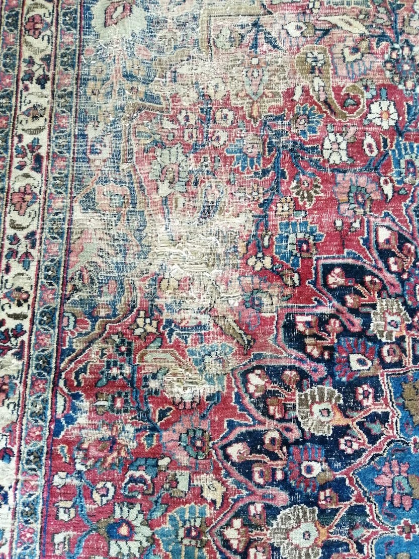 An antique Heriz red ground carpet, 420 x 306cm
